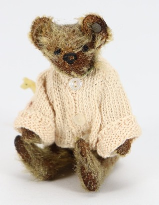 A miniature Steiff Teddy bear, circa 1910,