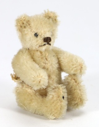 A Steiff miniature white mohair Teddy bear, 1950,