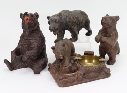 Four carved wooden Black Forest bears,
