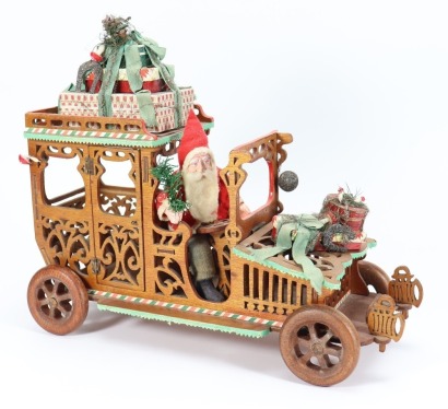 A rare wooden Christmas Limousine candy container with Santa Claus chauffeur, German circa 1910,