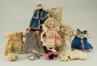 Miniature all-bisque doll with trunk and clothes, German circa 1910,