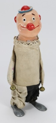 A clockwork walking composition headed clown, 1920/30s,