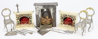 A pair of miniature painted cream tin-plate fire-places for dolls house, German circa 1860-70
