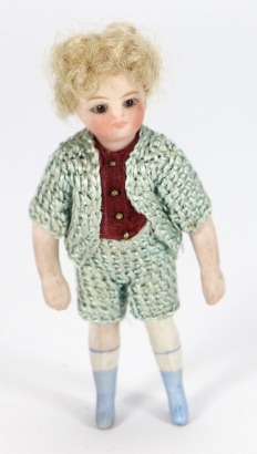 A miniature Mignonette all-bisque doll in original clothes, French 1880s