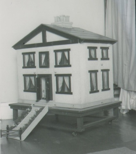 The 'Mc Rae' family dolls house and contents, 1920s,