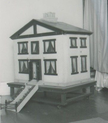 The 'Mc Rae' family dolls house and contents, 1920s,