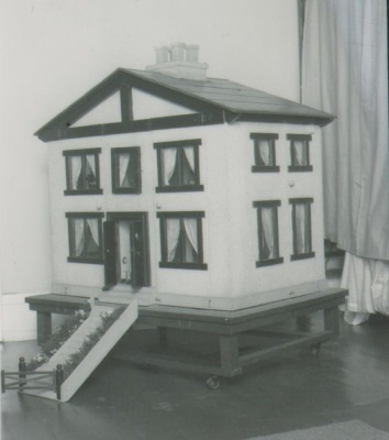 The 'Mc Rae' family dolls house and contents, 1920s,