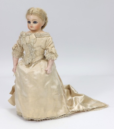 A Papier-m&acirc;ch&eacute; shoulder head doll in original bride costume, German 1890s