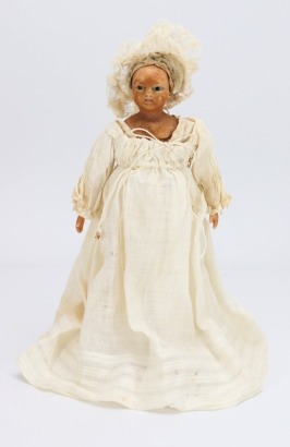 A rare early bees wax shoulder head doll in original clothes