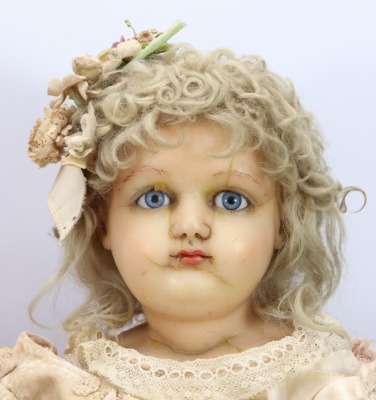 A large wax over composition shoulder head doll, English circa 1860 - 2