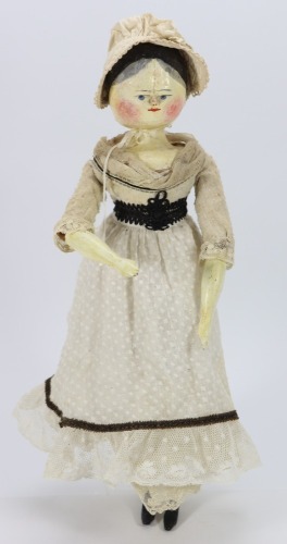 A large painted wooden peg doll, German circa 1890