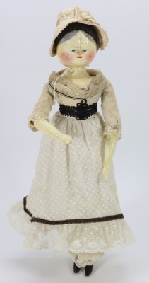 A large painted wooden peg doll, German circa 1890