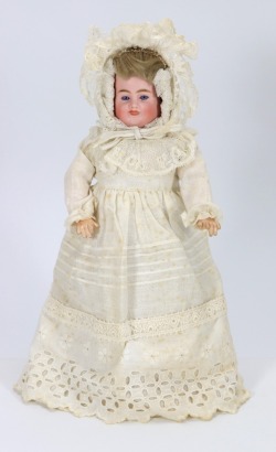 A rare Carl Bergner all original three faced bisque shoulder head doll, German circa 1905