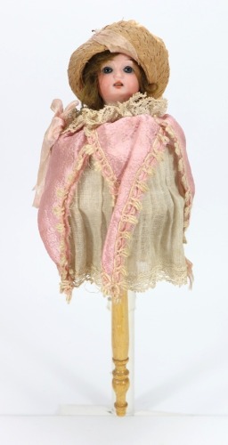 A Schoenau & Hoffmeister bisque head musical Marotte doll in jester costume, German circa 1900