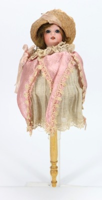 A Schoenau & Hoffmeister bisque head musical Marotte doll in jester costume, German circa 1900