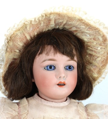 A Gebruder Kuhnlenz bisque head doll, German, (for the French market), circa 1910 - 2