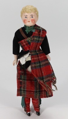 A Parian-type shoulder head doll in original Scottish costume, German circa 1890