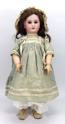 A large DEP bisque head doll in original clothes, German for the French market, circa 1910