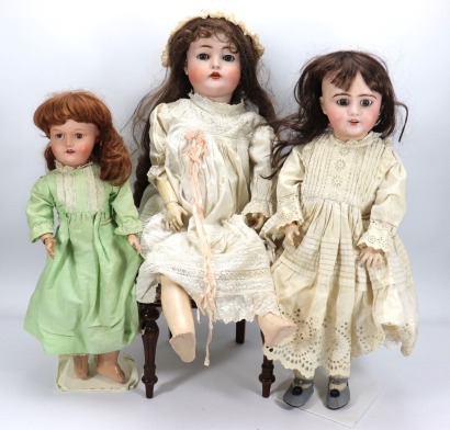 Three bisque headed dolls,