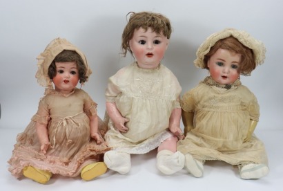 Four large bisque head German Baby dolls,