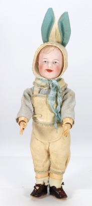 A rare Gebruder Heubach 7811 bisque head character doll wearing original 'Bunny' outfit, German circa 1910