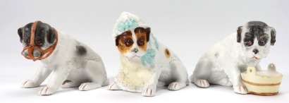 Gebruder Heubach three bisque dogs, German circa 1905,