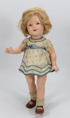 A Shirley Temple composition doll 'Curly Top' by ideal, American 1935-40