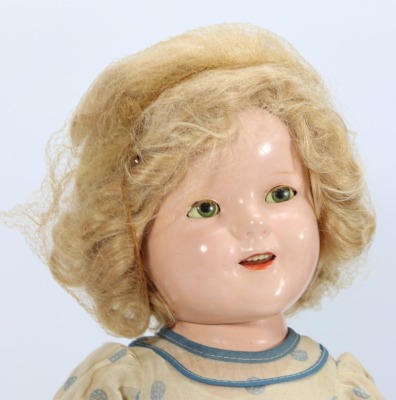 A Shirley Temple composition doll 'Curly Top' by ideal, American 1935-40 - 2