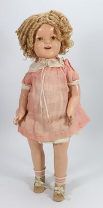 A Shirley Temple composition doll with rarer part cloth body, by Ideal