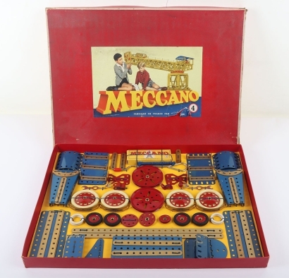 French Meccano Outfit No.4, 1960s, set containing blue, red and gold components tied to backing card, excellent condition, box good to fair, lid grubby and part tear/loss to paper label.