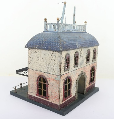 Bing 0 gauge Railway Station, brick effect building painted in shades of cream and orange, blue tiled effect roof, lithographed central arch and windows and glass tinplate framed canopy, 23.5cm wide, 22.5cm deep, 32cm high, fair condition, wear and paint - 4