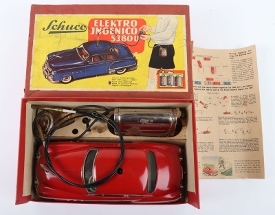 Schuco Ingenico 5380U Limousine Car, red clockwork and battery operated (untested) lithographed and painted tinplate two-door Limousine circa 1952, in very good used original condition, with battery pack (some rusting) and hand steering wire, bonnet masco - 2