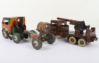 Mettoy Tinplate Military Searchlight Lorry, working clockwork motor, camouflaged tinplate body, searchlight, three tinplate soldiers, grey balloon tyres, in fair to good original condition, Approx.27 cms long and a Tippco Military Anti-Aircraft Lorry, lit - 3