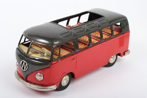 Bandai friction driven VW van, Japanese circa 1960, finished in red with dark grey top, chrome bumpers and tin printed interior, 7 3/4 (19.5cm) long