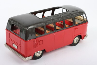 Bandai friction driven VW van, Japanese circa 1960, finished in red with dark grey top, chrome bumpers and tin printed interior, 7 3/4 (19.5cm) long - 2