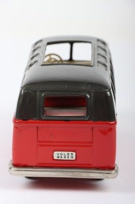 Bandai friction driven VW van, Japanese circa 1960, finished in red with dark grey top, chrome bumpers and tin printed interior, 7 3/4 (19.5cm) long - 4