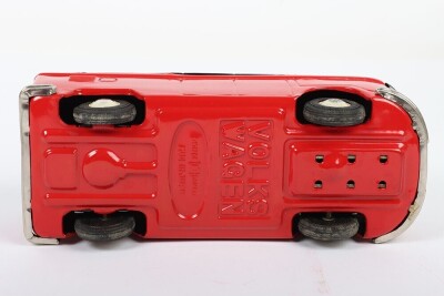 Bandai friction driven VW van, Japanese circa 1960, finished in red with dark grey top, chrome bumpers and tin printed interior, 7 3/4 (19.5cm) long - 5