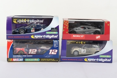 Four Boxed Slot Cars