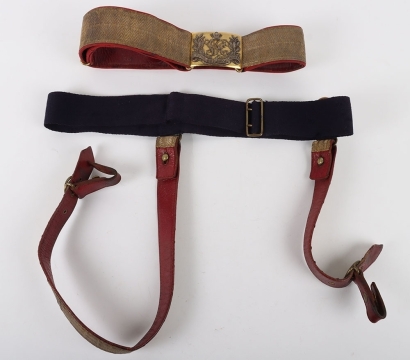 6th Inniskilling Dragoon Officers Full Dress Waist Belt & Slings. Red leather waist belt with scarlet cloth edges and under tunic sword slings all with gilt regimental lace, however a non regimental VR silver & gilt dragoon buckle. In good condition.
