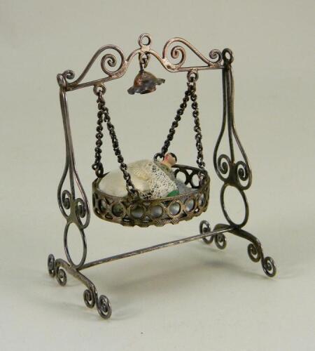 A Silver metal dolls house hanging cradle, continental 19th century,