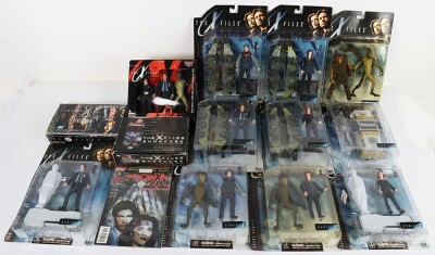 Collection of The X-Files Action Figures, Trading cards and Comics.