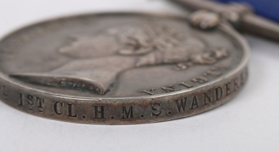 A Victorian Navy Long Service and Good Conduct Medal to a Ships&rsquo; Corporal on H.M.S. Wanderer, VR narrow suspension, impressed naming, &ldquo;ROBT CUDE, SH CORPL 1ST CL. H.M.S. WANDERER&rdquo;.Robert Cude was born in Millerston, Somerset on 8th June 1858. He initially - 6