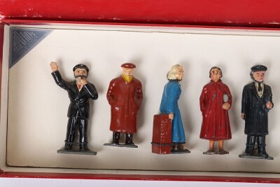 Timpo boxed Railway Staff and Passengers, 1950s, Station Master, Guards blowing whistle, porters with luggage, Mrs Smith, Mrs Green, Commercial traveller and boy all tied to backing card together with girl, Mr Brown, Hiker, Sailor with kit bag, two cases, - 2