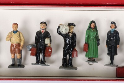 Timpo boxed Railway Staff and Passengers, 1950s, Station Master, Guards blowing whistle, porters with luggage, Mrs Smith, Mrs Green, Commercial traveller and boy all tied to backing card together with girl, Mr Brown, Hiker, Sailor with kit bag, two cases, - 3
