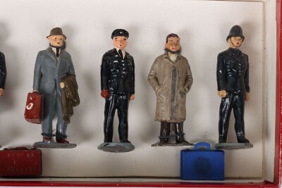 Timpo boxed Railway Staff and Passengers, 1950s, Station Master, Guards blowing whistle, porters with luggage, Mrs Smith, Mrs Green, Commercial traveller and boy all tied to backing card together with girl, Mr Brown, Hiker, Sailor with kit bag, two cases, - 4