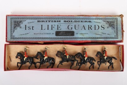 Britains set 1 1st Life Guards, third version 1897, four mounted troopers at the walk and Officer on rearing horse all with tin swords, in a printers label box, (good condition some slight wear, figures tied to backing card probably not original, box good
