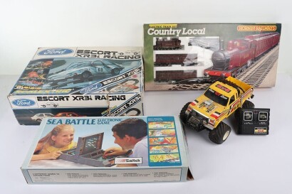 Collection of Vintage Toys. Including Sea Battle Electronic Game by Saitek untested, Hornby Railways Country Local Electronic Train Set 16440, Scalextric Escort XR3i Racing boxed untested appears complete, Radio Shack Off Roader 4x4 Remote control car loo