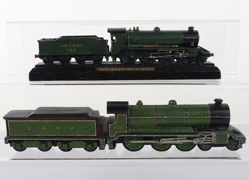 Two cast metal locomotive paperweights,