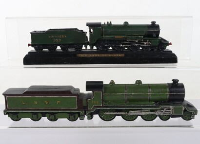 Two cast metal locomotive paperweights,