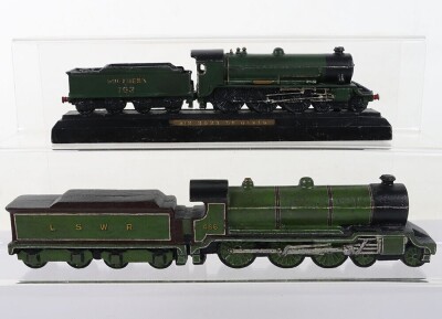 Two cast metal locomotive paperweights,